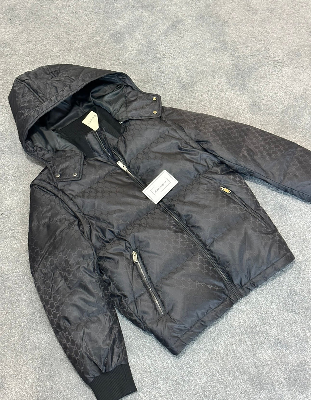 Gucci | Gucci black coat small logos | Detail Shot | yiodesigner.co.uk