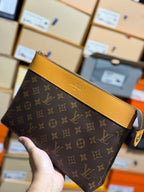 Louis Vuitton | Lv clutch bag | Front View | yiodesigner.co.uk