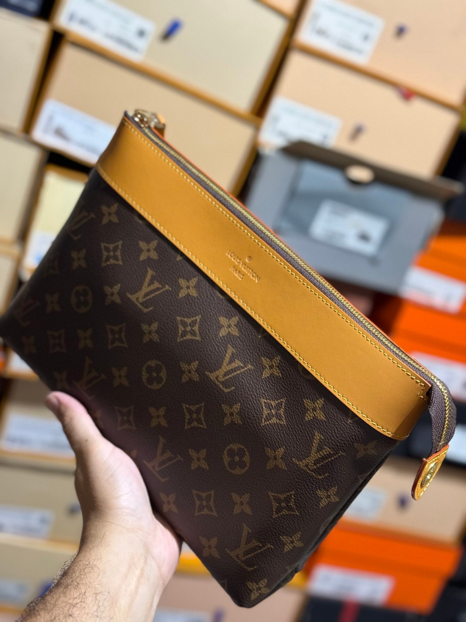 Louis Vuitton | Lv clutch bag | Side View | yiodesigner.co.uk